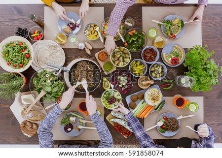 Green healthy vegetarian food for lunch with friends Royalty-Free Stock Photo #591858074