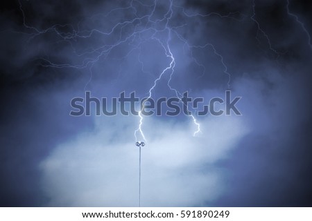 Lightning rod against a cloudy dark sky. Natural electric energy.