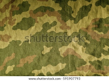Old camouflage uniform cloth pattern. Abstract background and texture for design.