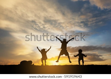 silhouette children jump 