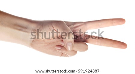 Hand showing the sign of victory and peace. Close up of female hand showing victory sign isolated on white background. Woman hand gesturing peace sign.