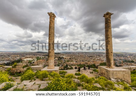 Photo taken from Urfa Castle two pillar, some castle structures and the city is on the picture.