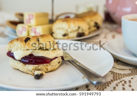 British Afternoon Tea with Cream Scones  Royalty-Free Stock Photo #591949793