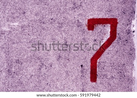 Number seven on grungy cement wall. Abstract background and texture.
