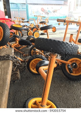 Steel yellow bicycles for children in school playgrounds