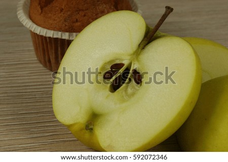 Chocolate muffin and apple closeup