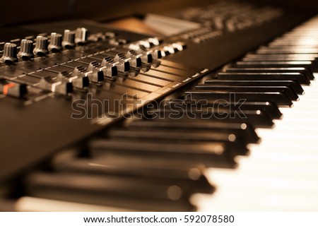 Synthesizer Keyboard closeup in golden colors