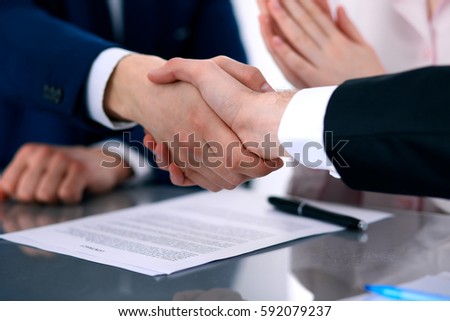 Business people shaking hands finishing up a meeting