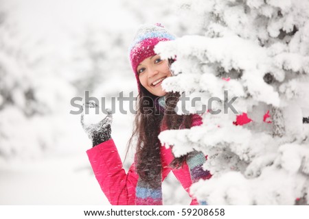 winter woman play snowballs