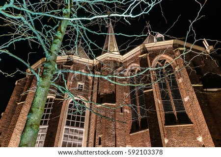 Exterior of a medieval gothic church in the night. Photographed with slow shutter speed photography. Kampen, Overijssel - Netherlands. 