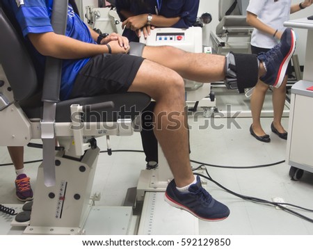 An athlete was doing isokinetic test for his leg. (kick forward movement) Royalty-Free Stock Photo #592129850