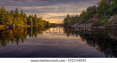 Fall Sunset at the Kawartha Highlands Provincial Park
Bass fishing from a canoe on Wolf lake, Ontario, Canada Royalty-Free Stock Photo #592154045