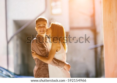 man and woman posing on the street
