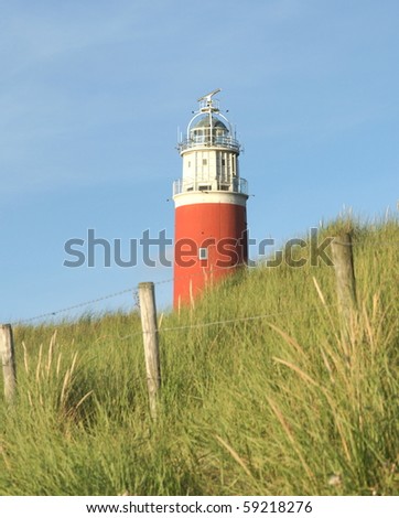 red lighthouse in the dunes