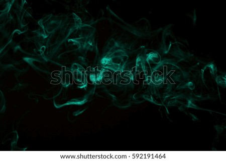 Green smoke on dark background