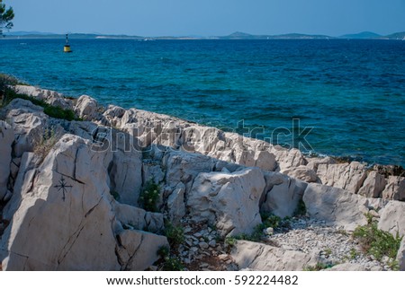 photo of Wind-rose painted on the rocks, adriatic sea, croatia, Vrgada Island