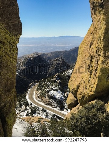 Mt. Lemmon in Tucson Arizona, hoodoos, patches of snow, and roadway back down to the City of Tucson.