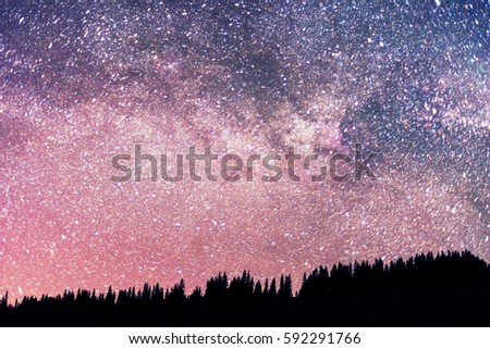 Starry sky above the earth scenic natural phenomena in the atmosphere, a colorful mix of colors and tones - the distant lights of the universe galaxy star clusters, nebulae and comets meteors