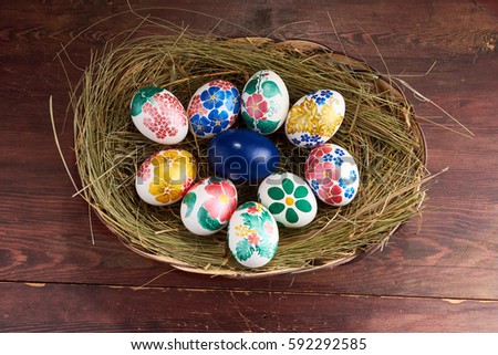 Hand painted easter eggs on the hay