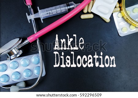 Ankle Dislocation  word, medical term word with medical concepts in blackboard and medical equipment background