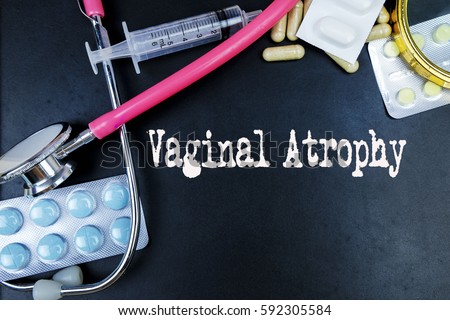 Vaginal Atrophy word, medical term word with medical concepts in blackboard and medical equipment background