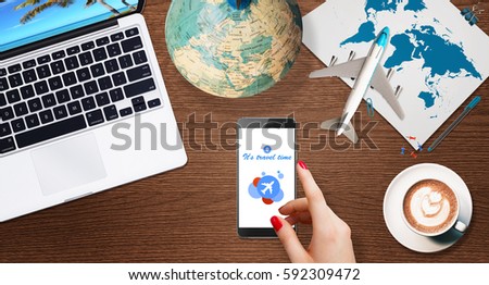 Woman searching online destination for vacation on modern smartphone, top view