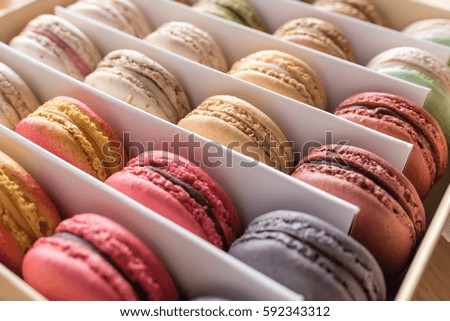 soft focus of assorted macaron in paper box