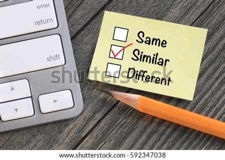concept of similar, with desk background  Royalty-Free Stock Photo #592347038