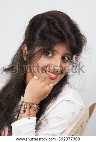 Beautiful Indian woman with happy smiling, Portrait of beautiful face of an young smiling woman with long brown hair.