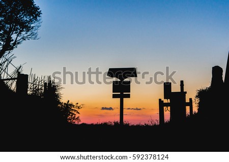 Silhouette wooden sign post