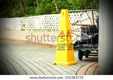Traffic cone for warning caution of wet floor.