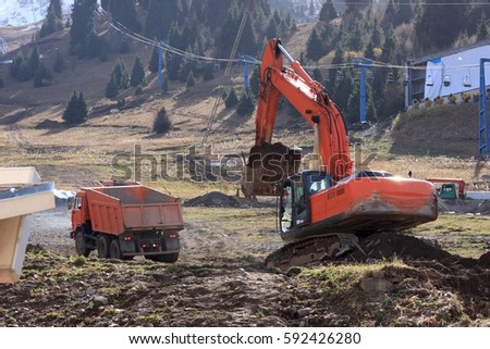 It is digging of the foundation pit by excavator, Kazakhstan, Chymbulak