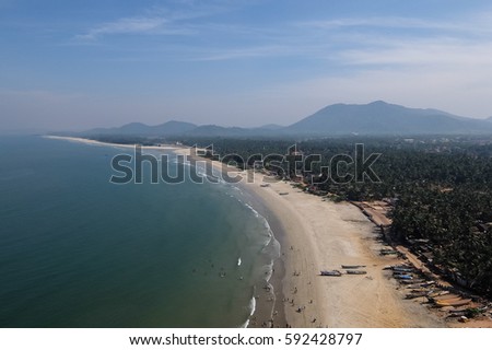 Ocean coast view in Murdeshwar, fisherman boats Royalty-Free Stock Photo #592428797