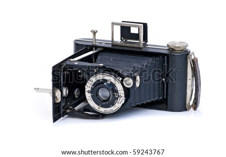 vintage roll film camera with bellows on white background