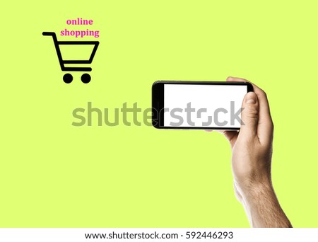 Hand holding smartphone online shopping concept, E-commerce with shop basket