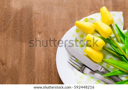 Festive Table Setting in White, Green and Yellow With Tulip. Concept Spring, Easter or Mother's Day. Selective Focus. Royalty-Free Stock Photo #592448216