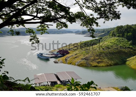  Lake and mountain in reservoir of Sirikit Dam with eblue sky cloud,  Uttaradit , Thailand
