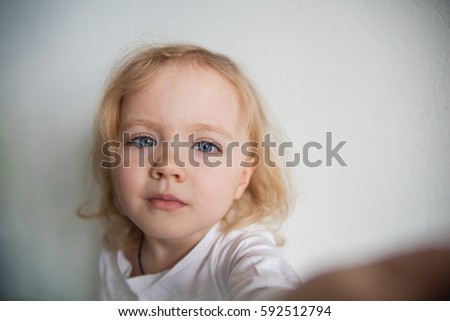 a beautiful little girl making a selfie