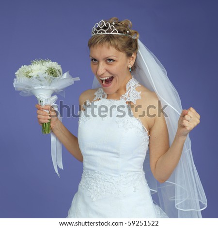 The beautiful bride in a white dress shouts with happiness