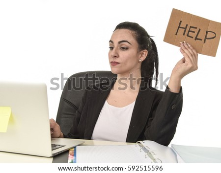 young attractive latin woman showing help sign desperate suffering stress at work while sitting at office laptop computer desk in business overwork female feeling stressed and overwhelmed