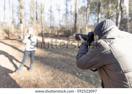 male photographer with the camera on nature