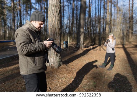 male photographer with the camera on nature