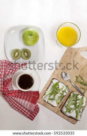 The ideal breakfast for the proper energy for the full day. Coffee with milk, orange juice, fruit . Top view