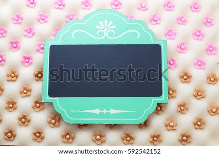 blank signboard on home made decorative flower