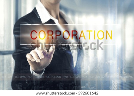 Business women touching the corporation screen