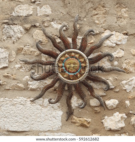 sun souvenir symbol on the wall