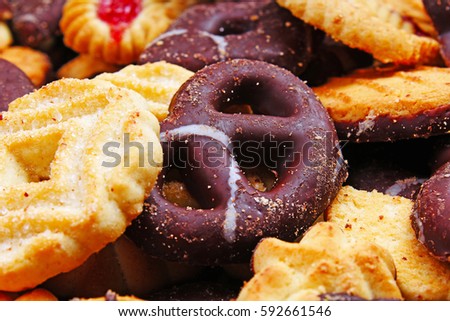 Cookies. Cookie crumpet tea biscuit pattern. Crumpets as background. Biscuits crumpet pattern texture. Chocolate coated biscuits.