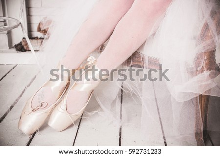 Ballerina legs in pink ballet shoes
