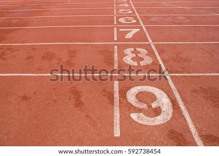 Spotlights stadium,Running track for the athletes background,Running track numbers in front of tracks