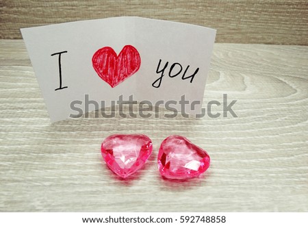 love valentine's day composition with hearts greeting card on wooden background